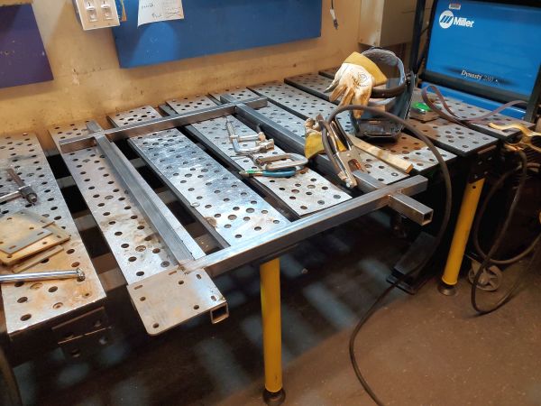 steel tube and plate lined up for welding